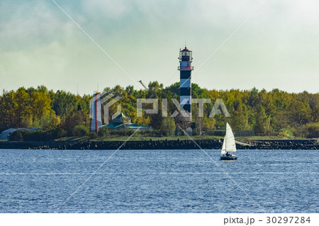Small sailboat traveling 30297284