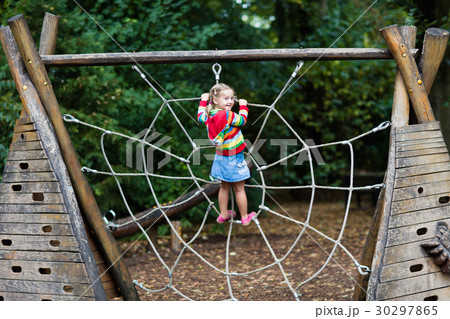 Child having fun on school yard playground 30297865