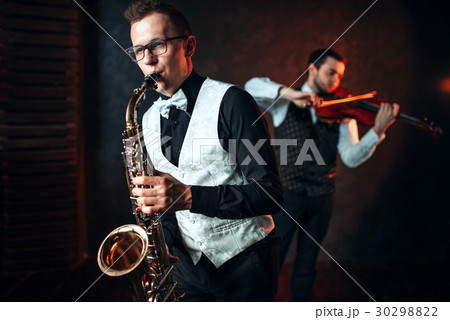 Sax man and fiddler duet playing classical melody Sax man and fiddler duet playing classical melody 30298822