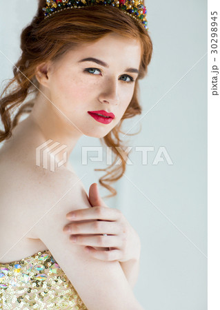 Beautiful redhaired fashion model posing Beautiful redhaired fashion model posing 30298945