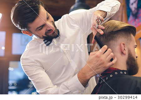 Young Man in Barber Shop Hair Care Service Concept Young Man in Barber Shop Hair Care Service Concept 30299414
