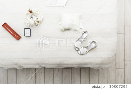 Shoes and earrings for a wedding 30307295