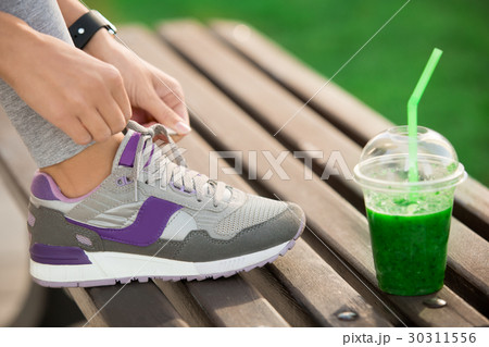 Young woman lace up snickers healthy sporty Young woman lace up snickers healthy sporty 30311556