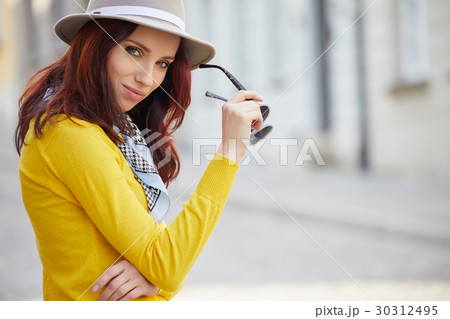 Fashionably dressed woman on the streets of a small Italian town Fashionably dressed woman on the streets of a small Italian town 30312495