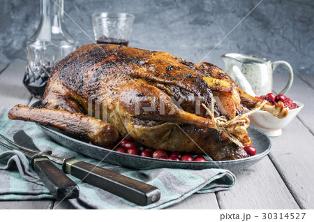 Roast Goose with Potatoes, Apple and Quince Roast Goose with Potatoes, Apple and Quince 30314527