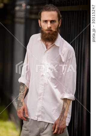 Cool looking hipster guy wih long beard Cool looking hipster guy wih long beard 30315247