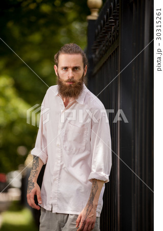 Cool looking hipster guy wih long beard 30315261