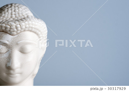Buddha face. Buddha statue made of white marble 30317929