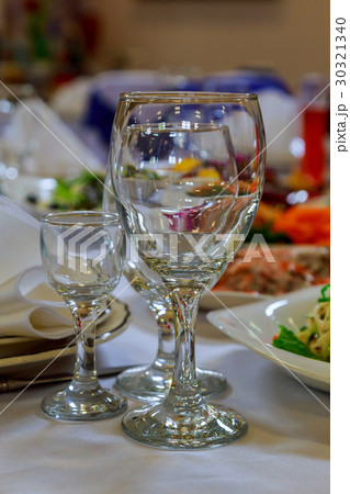 Delicious prepared and decorated food on table  30321340
