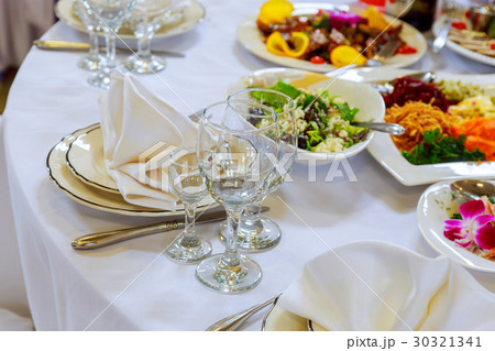 Beautifully decorated table set with flowers Beautifully decorated table set with flowers 30321341