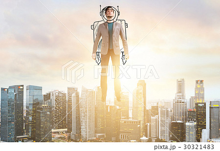 Business man hover over city skyline 30321483