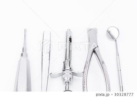 Dental tools and equipment on white background Dental tools and equipment on white background 30328777
