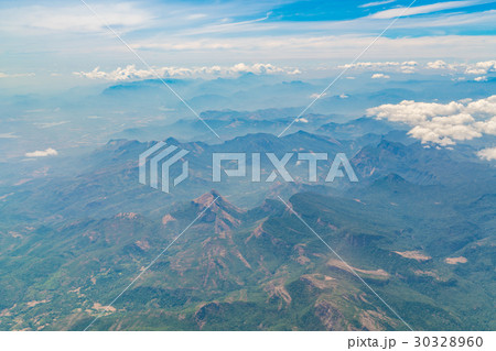 Mountains under clouds. View from the airplane . Mountains under clouds. View from the airplane . 30328960