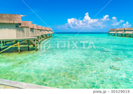 Beautiful water villas in tropical Maldives island . 30329019