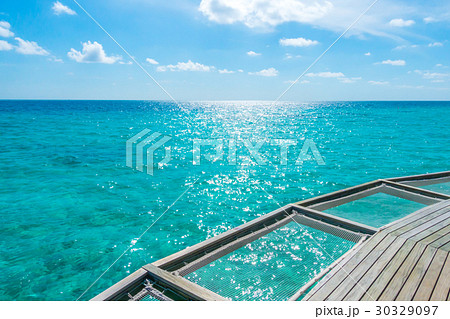 Vacation net seat in tropical Maldives island and beauty of the sea with the coral reefs . Vacation net seat in tropical Maldives island and beauty of the sea with the coral reefs . 30329097