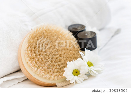spa and beauty threatment products with white towel spa and beauty threatment products with white towel 30333502