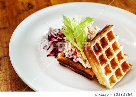 Savory waffles with salad 30333864