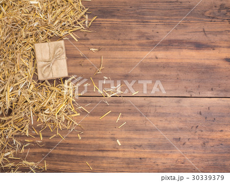 Rural eco background with gift box and straw on 30339379