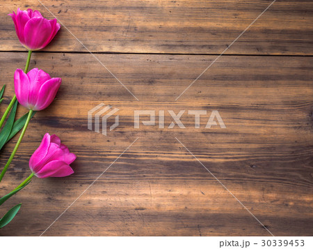 Pink tulips, floral arrangement on wooden Pink tulips, floral arrangement on wooden 30339453