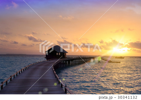 wooden road from the island to a hut over water on wooden road from the island to a hut over water on 30341132