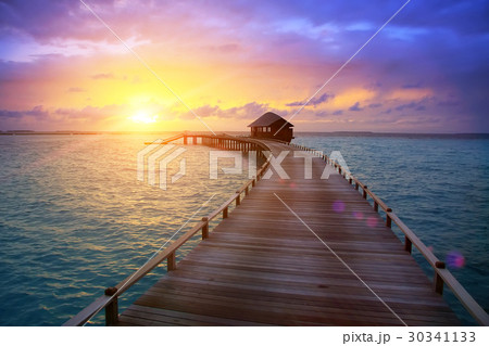 wooden road from the island to a hut over water on wooden road from the island to a hut over water on 30341133