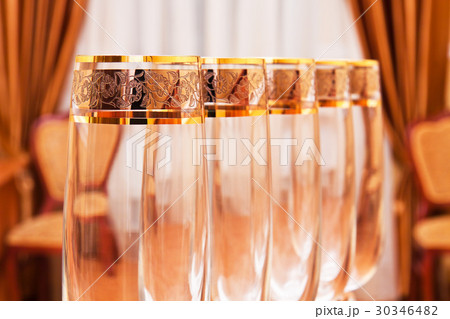 Row of empty wine goblets in restaurant Row of empty wine goblets in restaurant 30346482