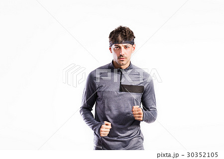 Handsome fitness man in gray sweatshirt, studio 30352105