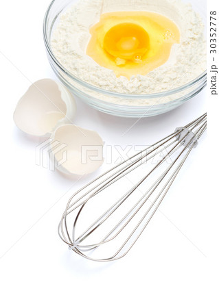 Flour with egg in glass bowl Flour with egg in glass bowl 30352778