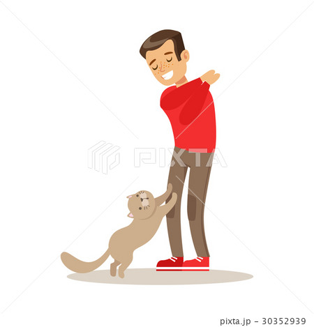 Smiling boy playing with his gray cat. Colorful 30352939