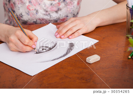 Closeup of drawing human eye at the desk 30354265