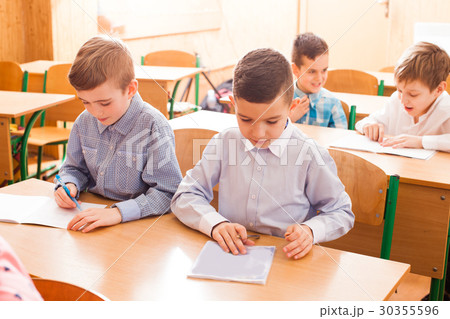 Boy white in the copybook 30355596