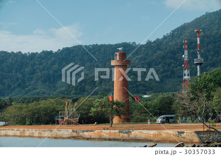 Brick lightho use on the shore, against the 30357033