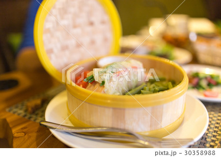 Fish with vegetables in a couple in a restaurant 30358988