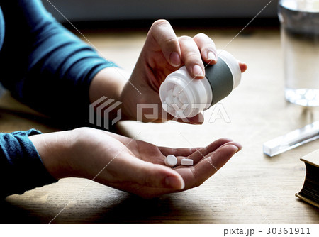 Adult Taking Medication Supplements Vitamins 30361911