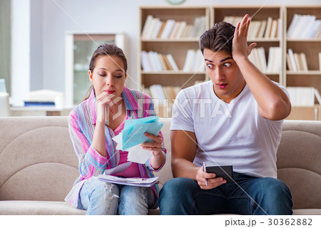 Young family discussing family finances 30362882