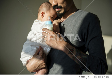 Father is taking care of his child. Father is taking care of his child. 30364740