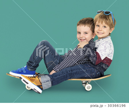 Little Kids Smiling Playing Sitting Skateboard 30366196