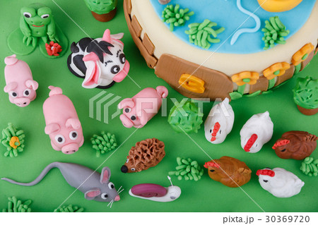birthday cake with farm marzipan animals 30369720