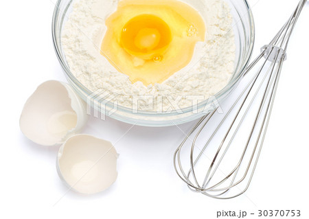 Flour with egg in glass bowl Flour with egg in glass bowl 30370753