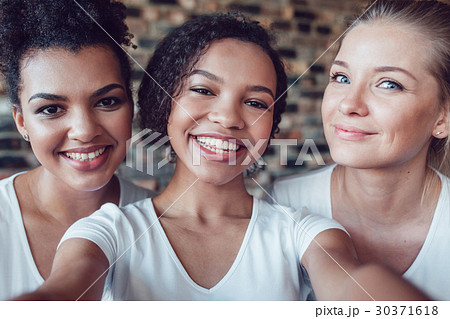 Beautiful and funny girls in white T-shirts makes Beautiful and funny girls in white T-shirts makes 30371618