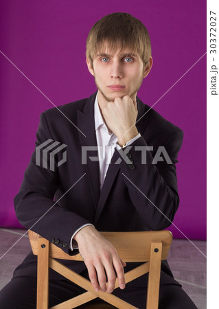 businessman sitting and looking ahead businessman sitting and looking ahead 30372027