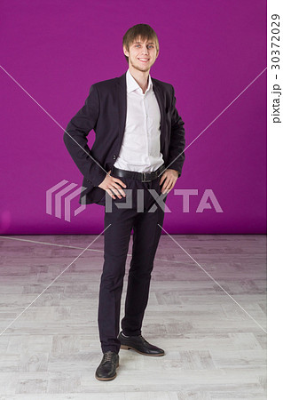 businessman stands and smiles businessman stands and smiles 30372029