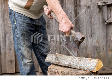 Worker, an elderly man with an old axe Worker, an elderly man with an old axe 30372414