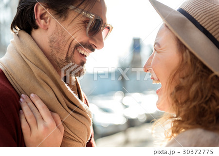 Smiling middle-aged couple resting in the city 30372775