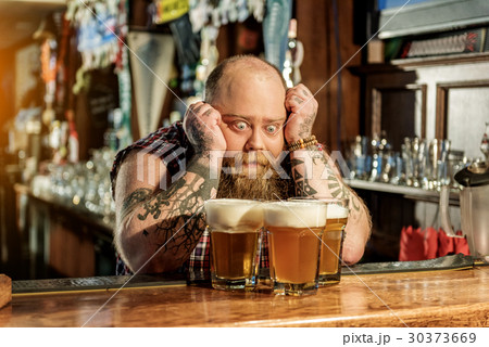 Wonder bearded male watching at beer Wonder bearded male watching at beer 30373669