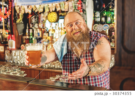 Fat male giving glass of beer 30374355