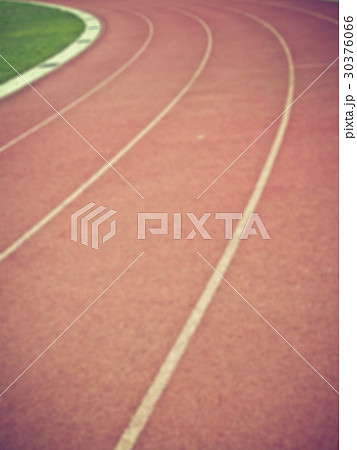 Blurred image of athletics running track. 30376066