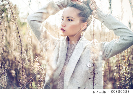 Fashion beautiful lady in autumn landscape 30380583