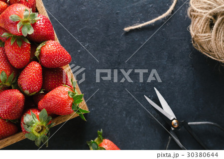 Top view of a wooden box with ripe fresh 30380644
