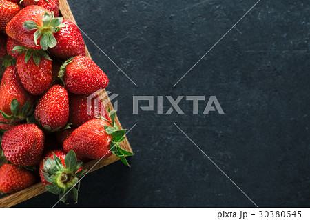 Top view of a wooden box with ripe fresh 30380645